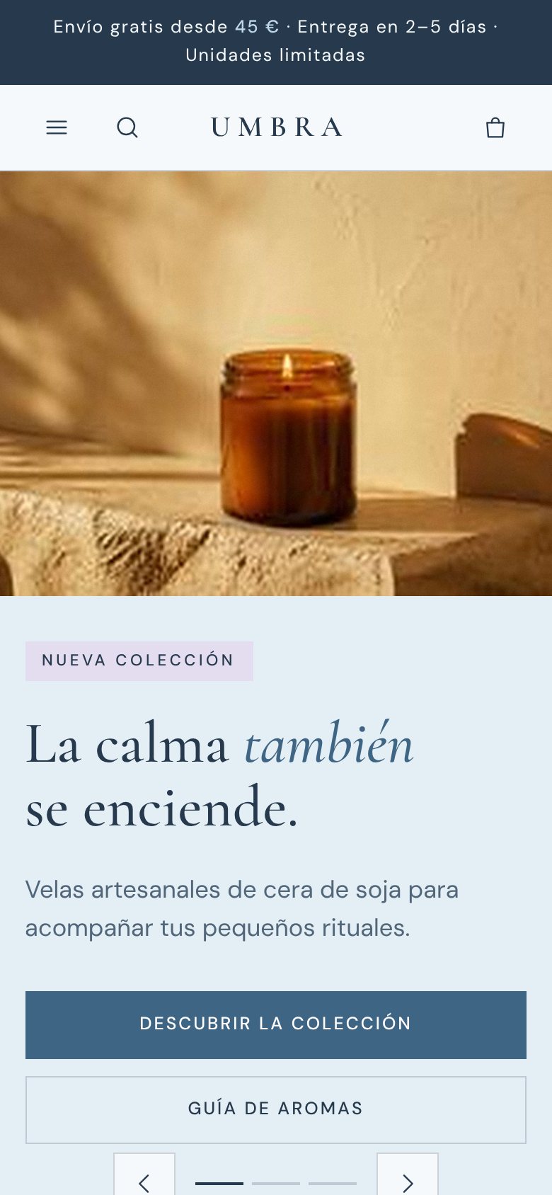 Portada de UMBRA en móvil: menú, buscador, logotipo, carrito y la vela ámbar con el titular debajo.